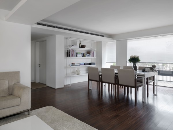 Dining room table in front of large windows