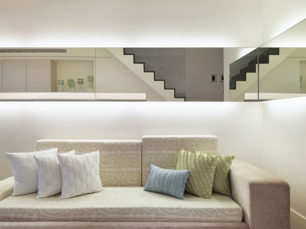 Throw pillows on patterned sofa