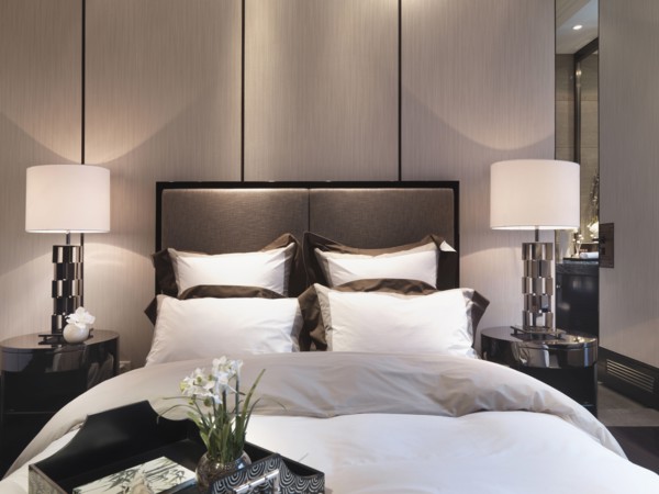 Serving tray on foot of bed in modern home