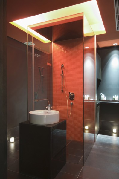 Interior of lit modern bathroom at spa