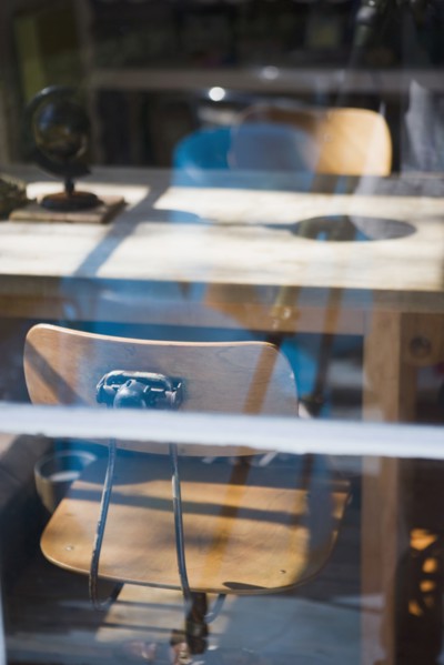 View through window old fashion desk chairs at table