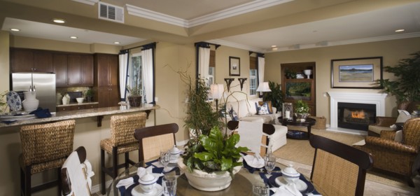 Contemporary view of kitchen living and dining areas of home