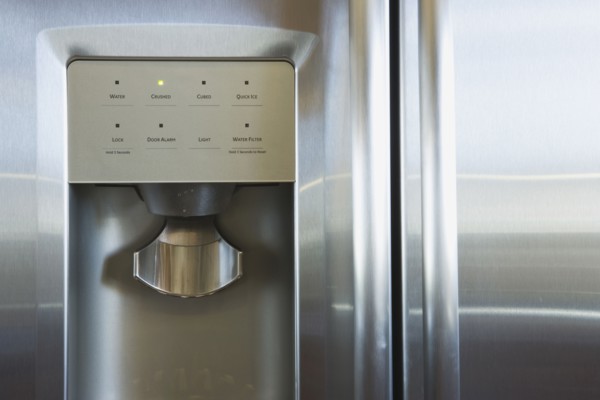 Detail of refrigerator door with water and ice dispenser
