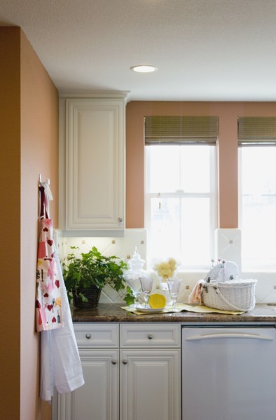 Aprons hanging on a kitchen wall