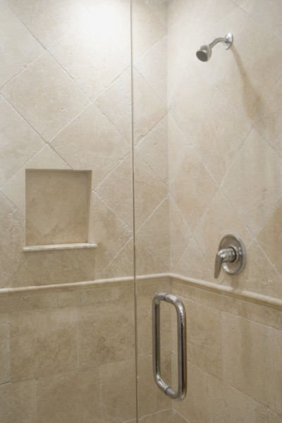 Detail of stone shower with glass door