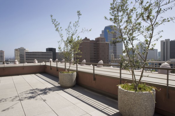 Outdoor patio with view of city.