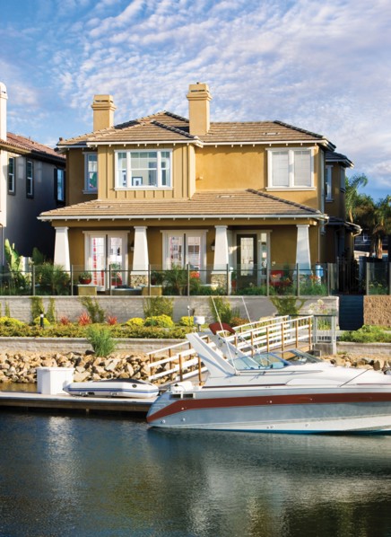 Exterior of one story house with speedboat in lake
