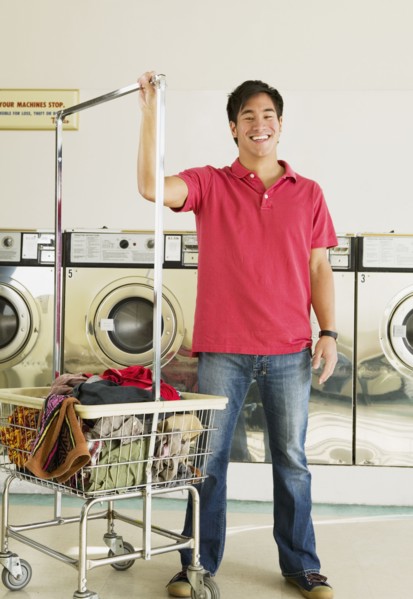 Asian man in laundromat