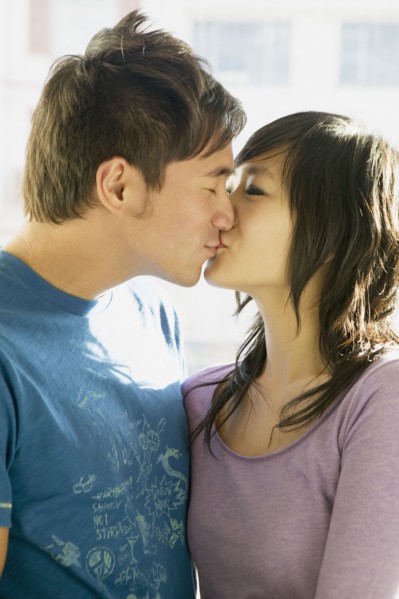 Asian couple kissing