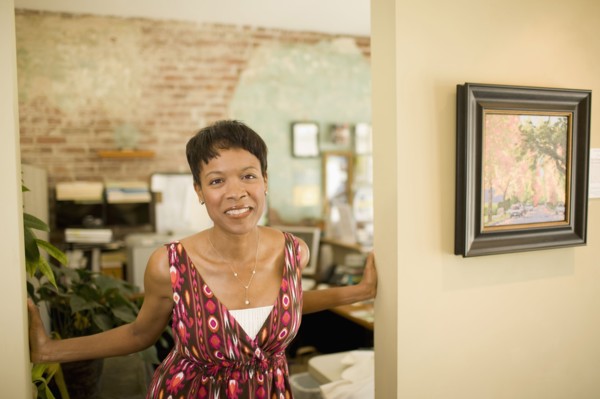 Mixed race woman standing in doorway