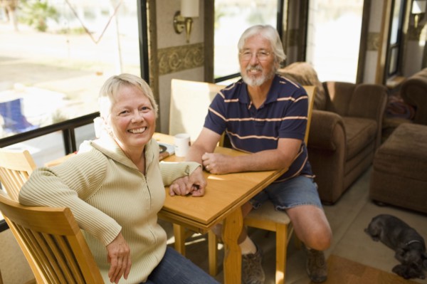 Senior Caucasian couple sitting in motor home