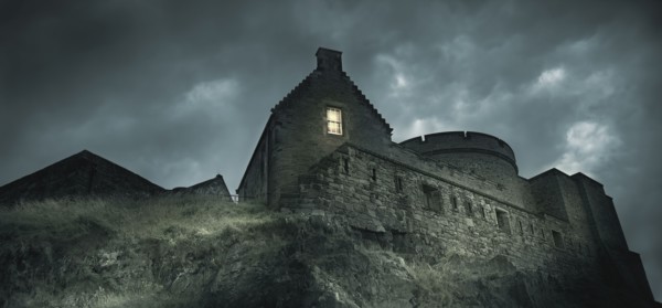 Low angle view of castle on rocky hill