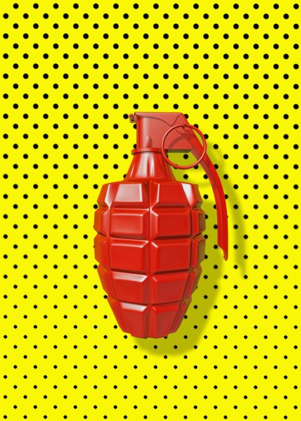 Close up of red grenade on polka dot background