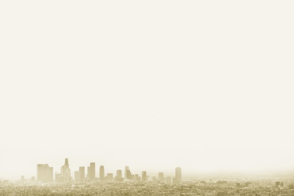 Silhouette of city skyline in hazy sky