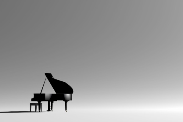 Grand piano and bench in empty room