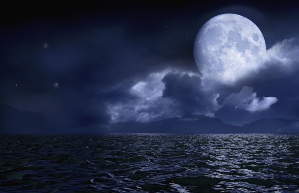 Full moon over seascape and horizon