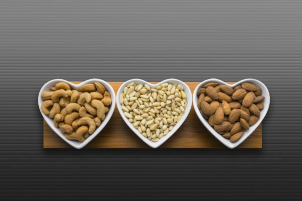 Heart-shaped bowls of heart-healthy nuts
