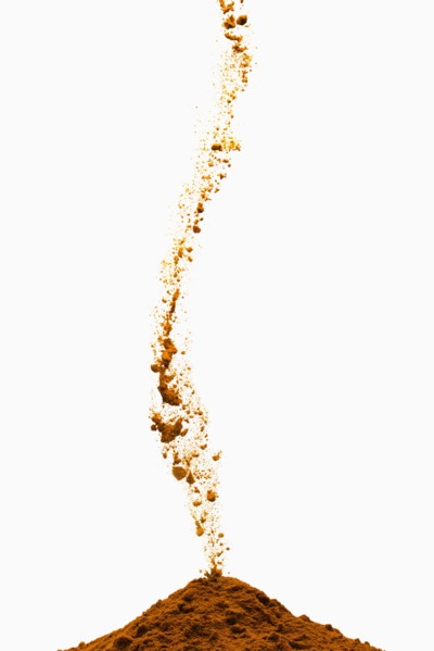 Brown powder pouring into pile