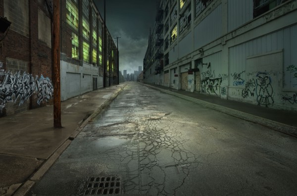 Graffiti on walls on empty city street