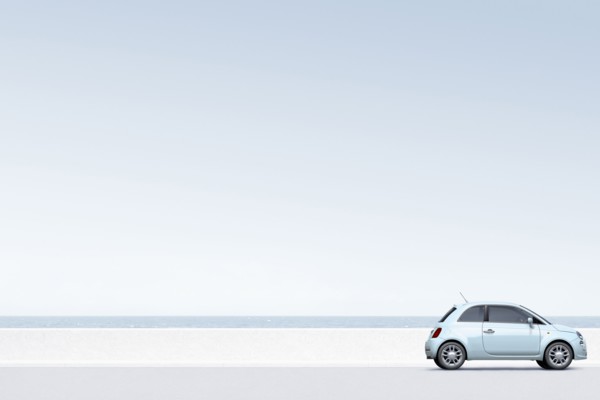 Blue car near ocean