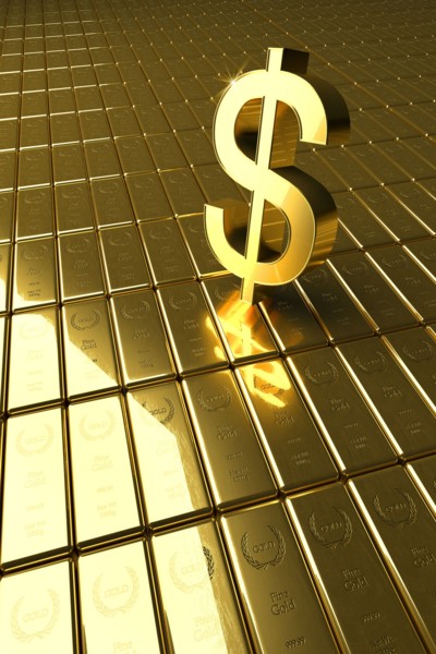 High angle view of gold bars and dollar symbol