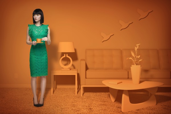 Caucasian woman in orange old-fashioned livingroom drinking coffee