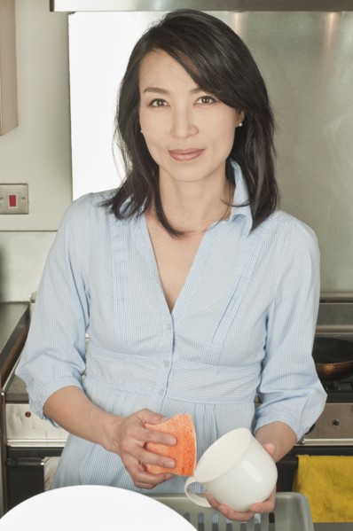 Korean woman washing dishes