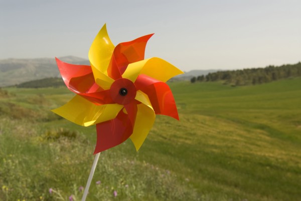 wind wheel over green fields