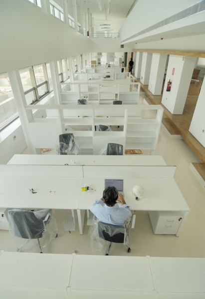 Man sitting in empty office elevated view