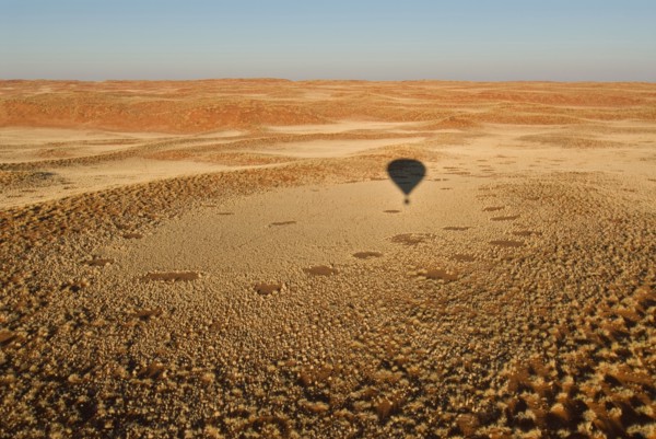 Namibia shadow of hot-air balloon above Namib Desert