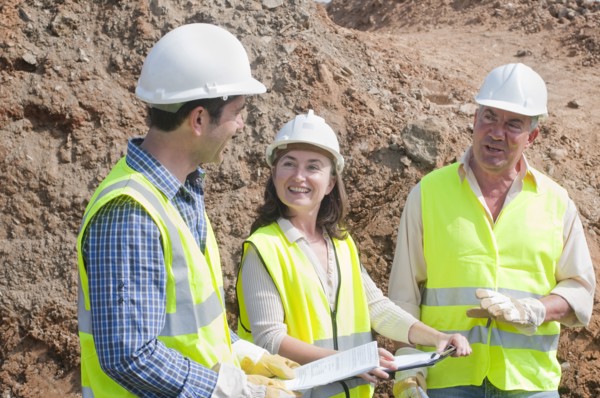 three engineers in construction site