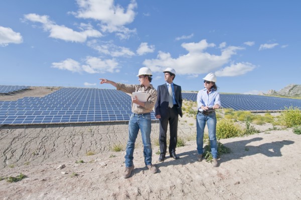 engineers and businessman in solar plant