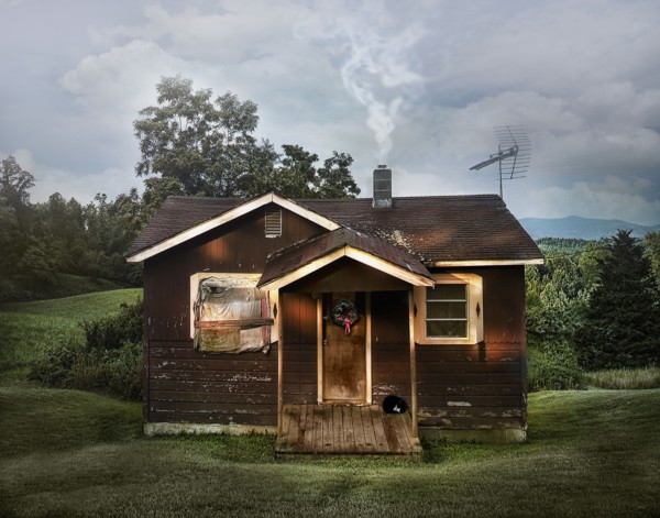 Dilapidated shack in rural field
