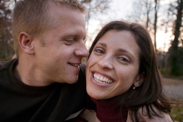 Smiling couple hugging outdoors
