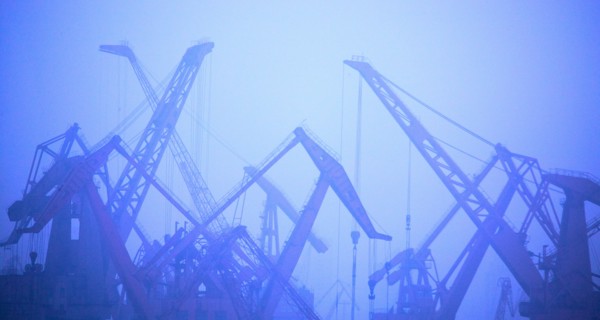 Construction cranes in fog