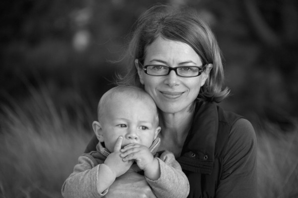 Portrait of smiling Caucasian mother holding baby son