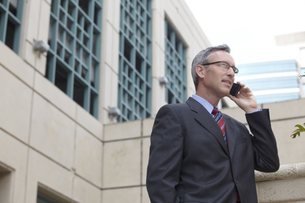 Caucasian businessman talking on cell phone