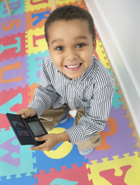 Mixed race boy playing video game