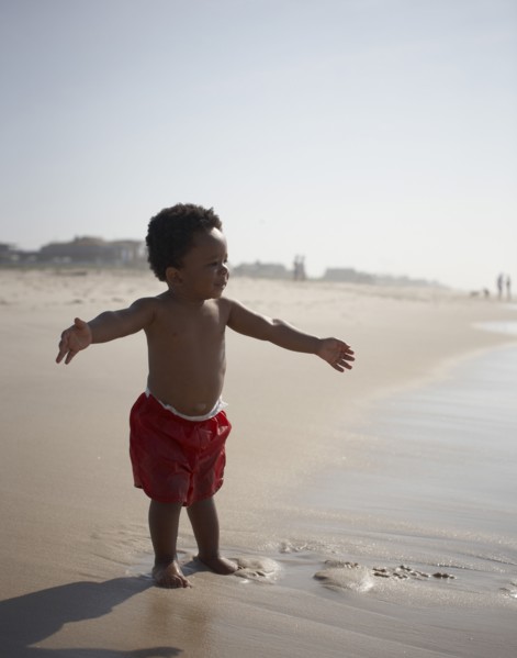 African American baby boy enjoying beach