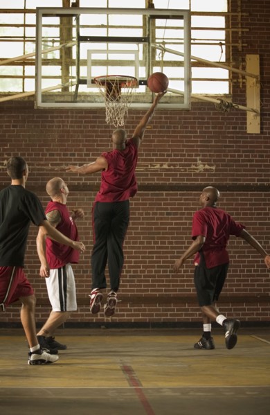 Men playing basketball