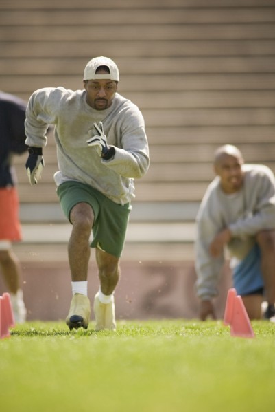 Men training on football field