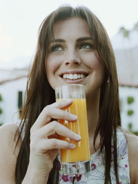 Woman drinking orange juice