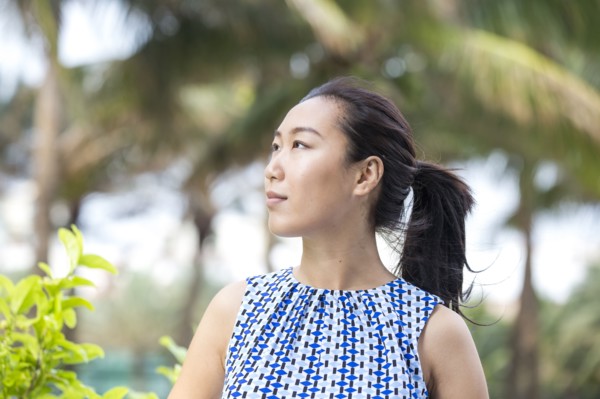 Asian businesswoman smiling outdoors