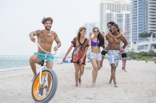 Friends walking on urban beach