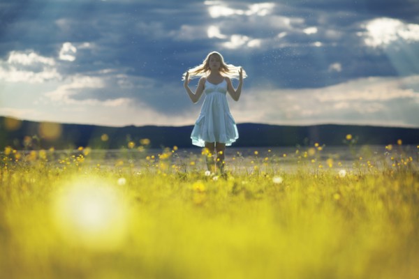 Caucasian woman walking in rural field