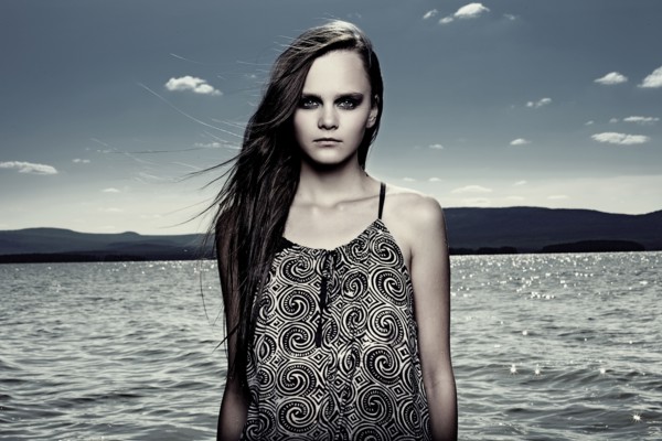 Woman wading in remote lake