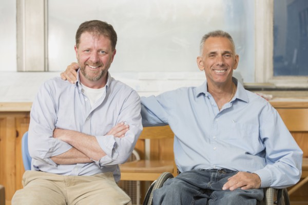 Caucasian businessmen smiling in office