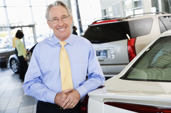 Car salesman smiling