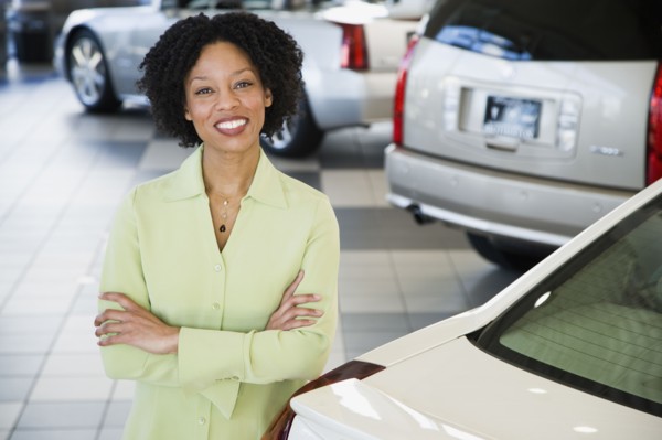 Car saleswoman smiling