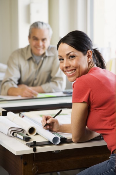 Hispanic female architect at desk